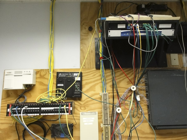 Communications hub—AFTER reorganization. Photo communications hub after reorganizing around a new LAN switch and WAN router.